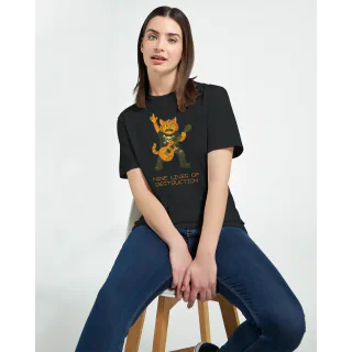 Woman sitting on a stool wearing a black T-shirt with rockstar cat illustration and Nine Lives of Destruction text